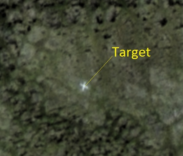 satellite orthophoto showing a clear ground survey target Figure 1b: The target is clearly visible in the 50cm resolution satellite photo.
